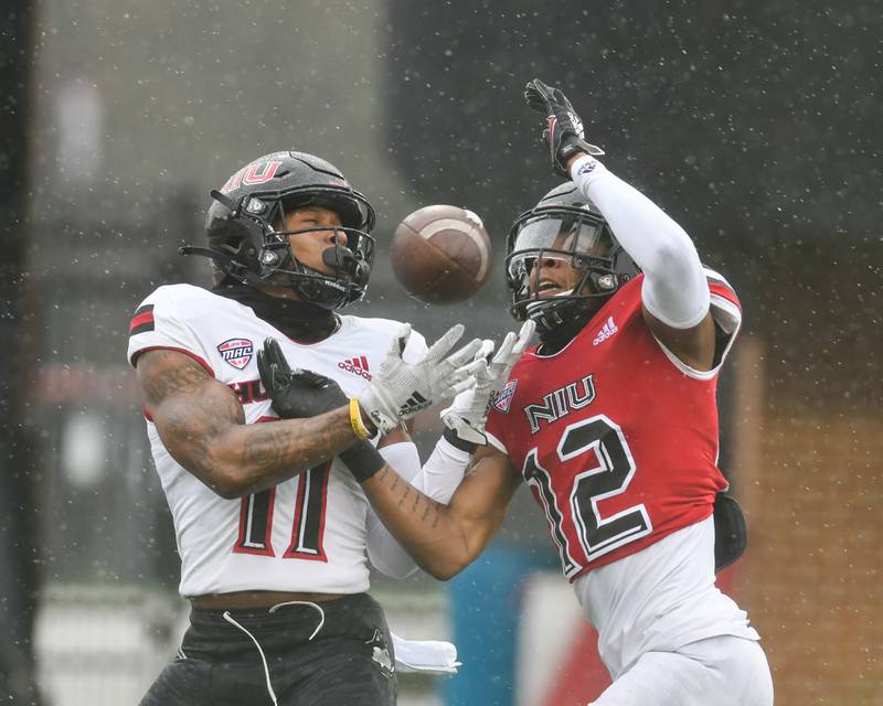 Northern Illinois University cornerback Eric Rogers (12) defends wide receiver Messiah Travis (11) to help to incomplete the pass during practice at Huskie Stadium held on April 10.