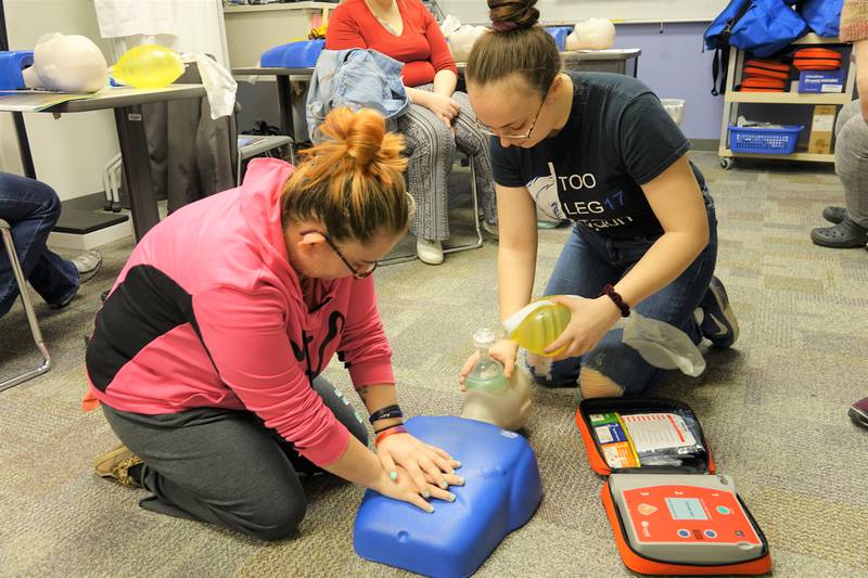 Illinois Valley Community College students from a previous Ottawa Center CNA class practice CPR. The Ottawa Center will offer several CNA course sections this fall.
