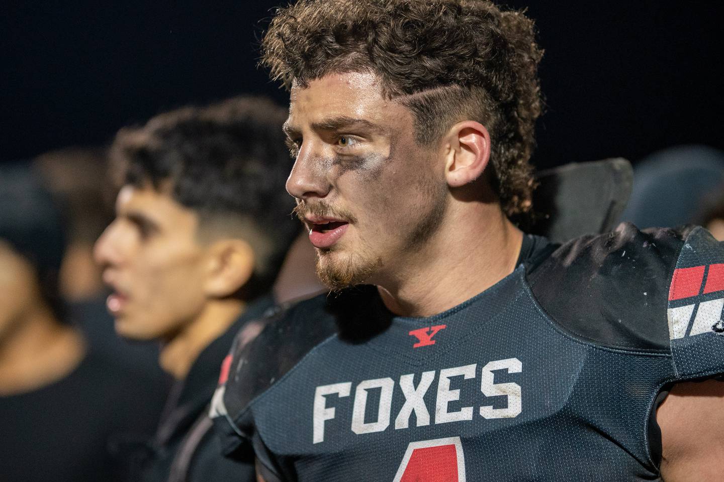 Yorkville's Kyle Gettemy (4) celebrates with fans after completing a defensive stop to beat Moline in quadruple overtime during a 7A second round playoff game at Yorkville High School on Friday, Nov 4, 2022.