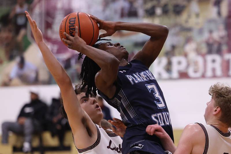 Plainfield South’s Jermaine Theodore gets the shot and the foul against Lockport on Wednesday January 25th, 2023.