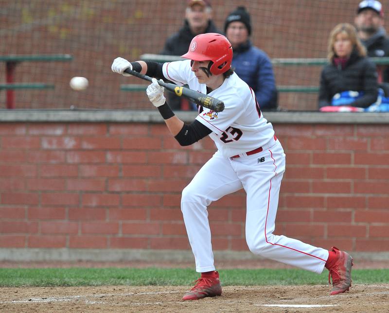 Benet's Colin Laughlin lays down a sacrifice bunt during a game against Montini on Apr. 28, 2022 at Benet Academy in Lisle.
