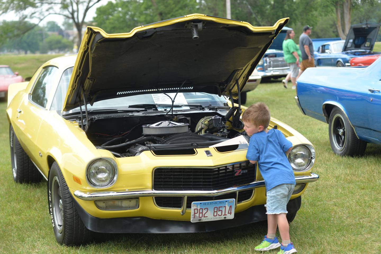 Waylon Coutts, 3, ot Sterling checks out Roger Pederson's 1970 Camaro at the Oregon Lions Club's Father Day's Car Show on Sunday, June 16, 2024. The Oregon car was one of 128 vehicles that took part in this year's show.