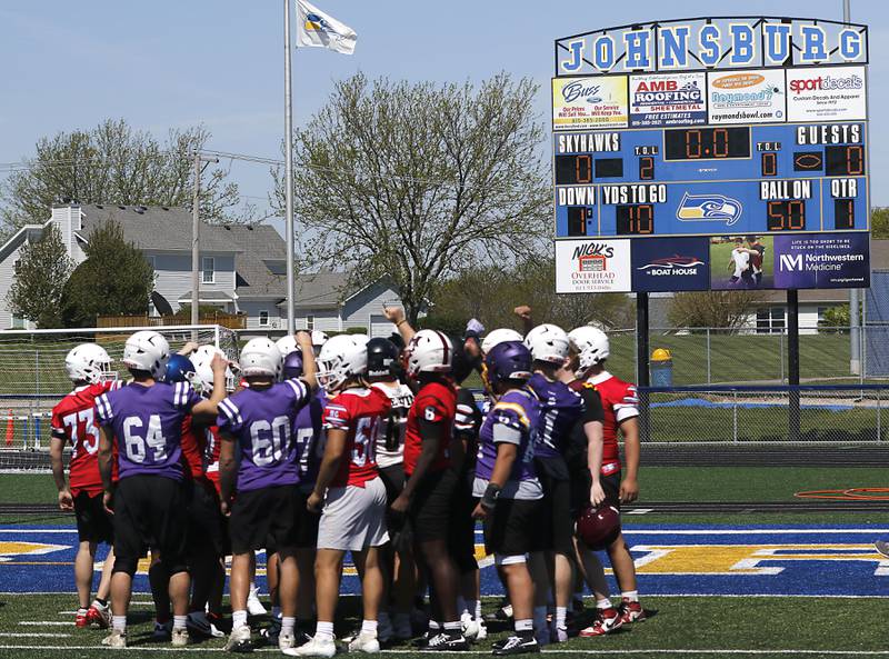 Players cheer at the end of the Northern Burbs Football Showcase on Monday, May 4, 2026, at Johnsburg High School. Over 165 players from 15 teams demonstrated their football skills to over 60 college coaches.