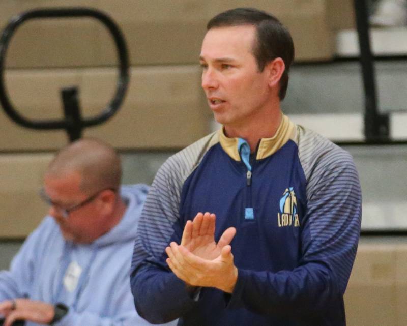 Marquette head girls basketball coach Eric Price coaches his team against Fieldcrest during the Integrated Seed Lady falcon Basketball Classic tournament on Monday, Nov. 13, 2023 at Flanagan High School.