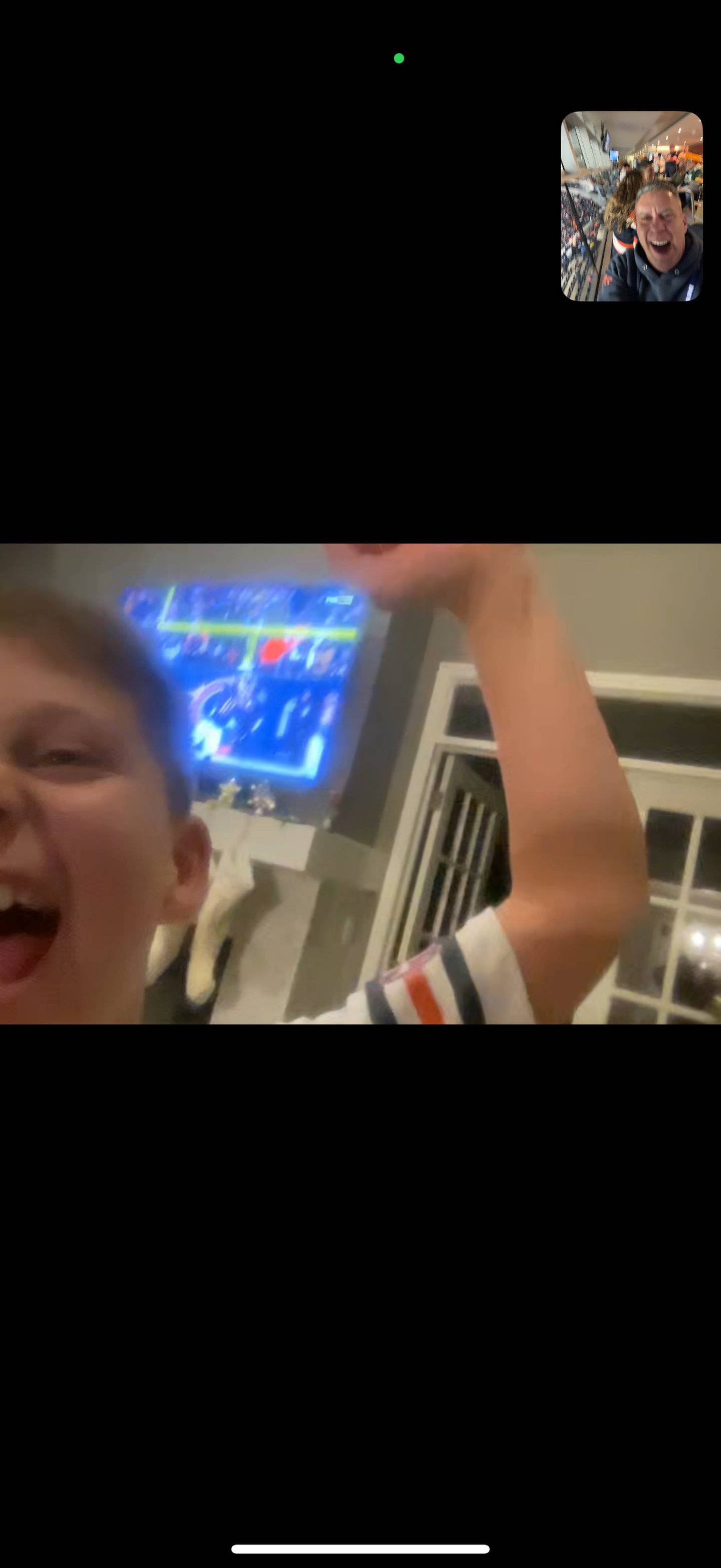 Marc Silverman Facetimes with his son, Braxton, during the Bears win over the Packers.