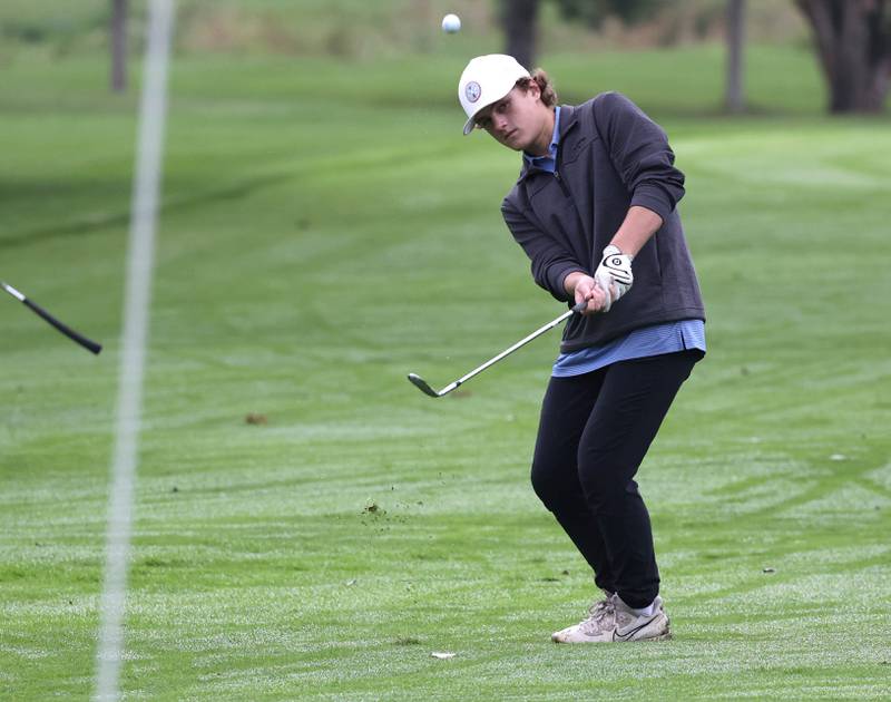 Burlington Central’s Matthew Kowalik chips onto the seventh green Wednesday, Sept. 27, 2023, during the Class 2A boys golf regional at Sycamore Golf Club.