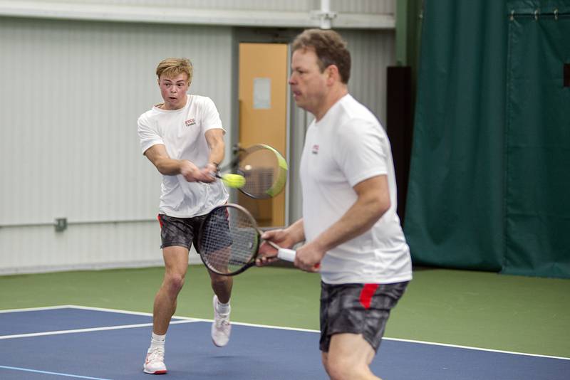 Sauk Valley College's Preston Engel returns a shot during a doubles match with dad Corey Saturday, April 2, 2022 at Westwood in Sterling. The father-son duo took on Milwaukee Area Tech's Josh Zaborski and Tim Haspel.