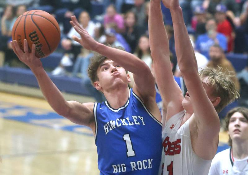 Hinckley-Big Rocks's Tyler Smith goes to the basket against Earlville's Adam Waite during their game Thursday, Feb. 1, 2024, in the Little 10 boys basketball tournament at Somonauk High School.