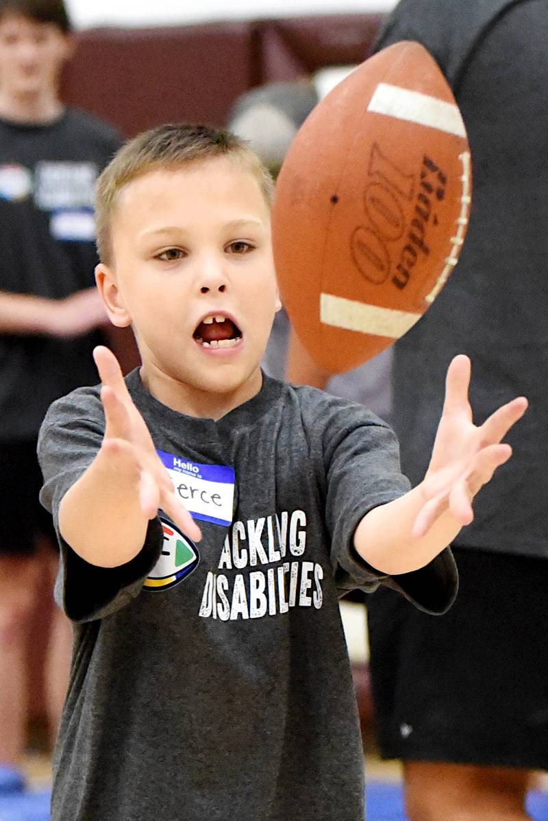 Pierce Storm catches a pass during Watseka's Tackling Disabilities football camp Saturday, July 26, 2025.