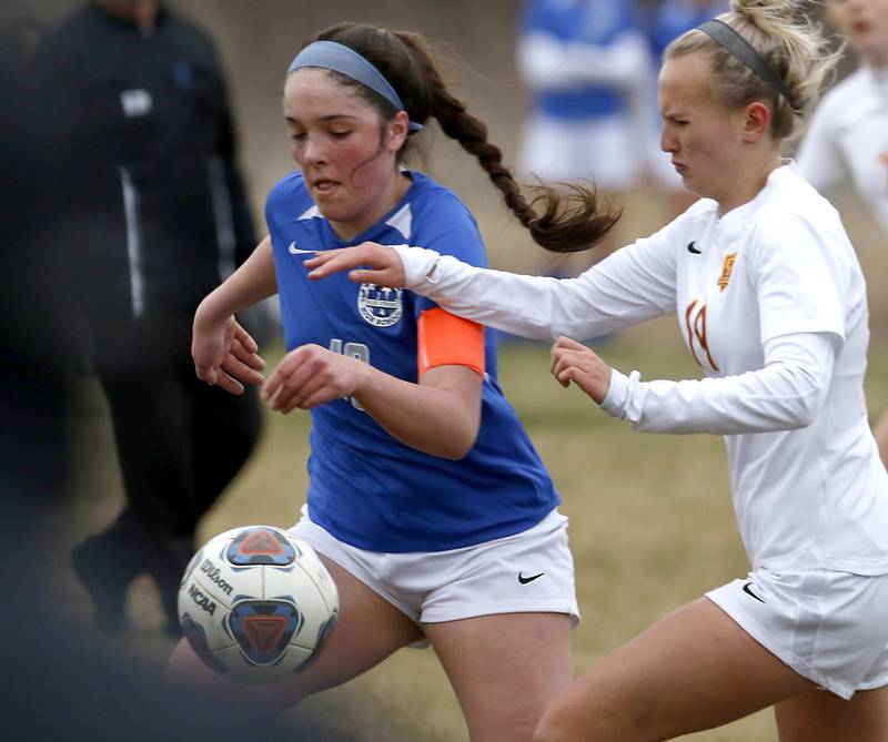 Woodstock's Natalie Morrow tries to control the ball in front of Richmond-Burton's Layne Frericks during a Kishwaukee River Conference soccer match Wednesday, April 30, 2022, between Richmond-Burton and Woodstock at Creekside Middle School.