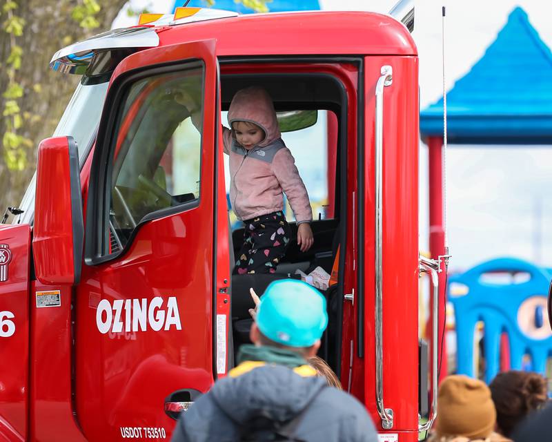 A child pulls the horn in a cement truck at the La Grange Touch a Truck event. April 22, 2023.