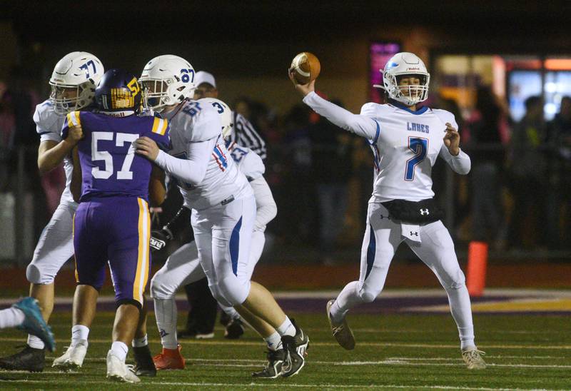 Lakes quarterback Max Bausch (7) throws to a receiver during Friday’s football game in Wauconda.