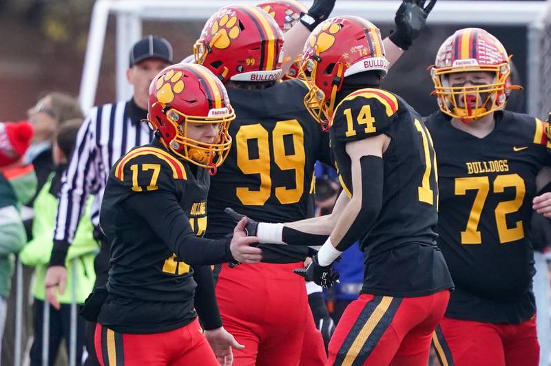 Batavia’s Caleb Peters (17) celebrates with Jake Mysliwiec (14) after kicking a field goal against Downers Grove North  during a class 7A quarterfinal playoff football game at Batavia High School on Saturday, Nov. 16, 2024.