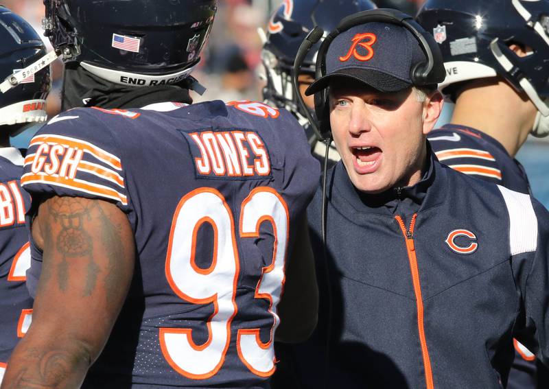 Chicago Bears Head Coach Matt Eberflus talks to Justin Jones during their game against the Green Bay Packers Sunday, Dec. 4, 2022, at Soldier Field in Chicago.