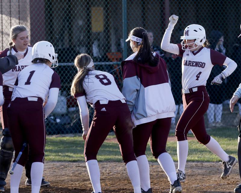Marengo's Josephine Christiansen (right) celebrates her home run during a nonconference softball game against Antioch on Monday, March 31, 2025, at Marengo High School.