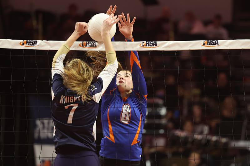 Genoa-Kingston’s Alivai Keegan goes for the block against IC Catholic in the Class 2A championship match on Saturday in Normal.