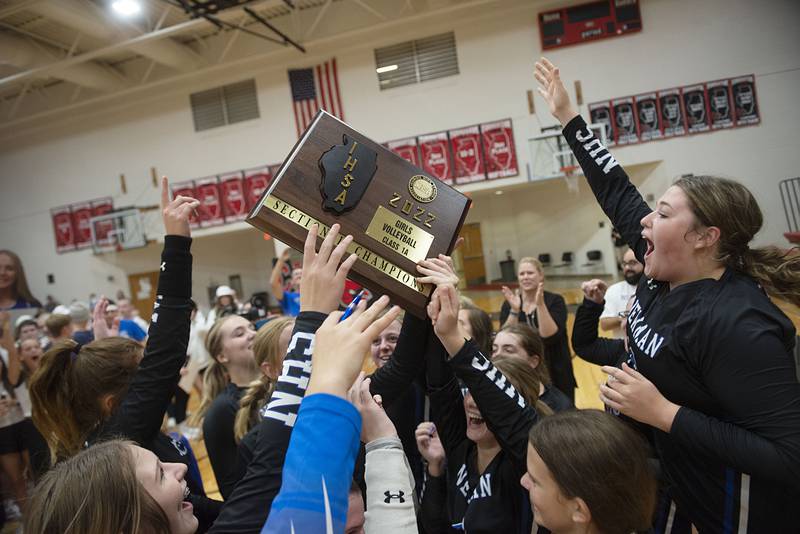 The Newman Comets celebrate their straight sets victory  Wednesday, Nov. 2, 2022 in the sectional championship game against River Ridge. The Comets will play for a chance to go to state on Friday.