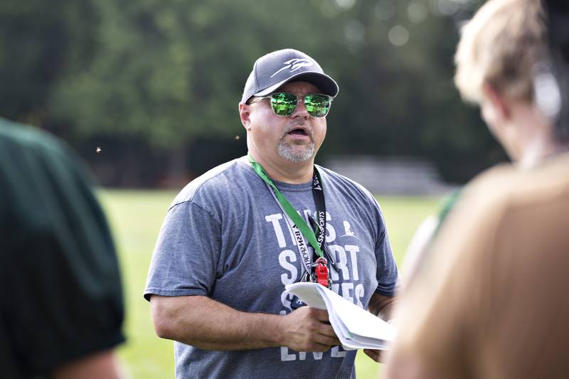 Rock Falls first year coach David Chavira runs his team through drills Tuesday, August 12, 2025. The team hit the gridiron for day two of practices ahead of the 2025 season.