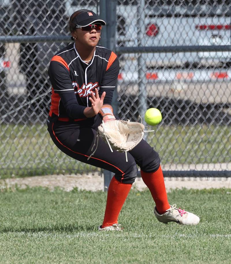 DeKalb's Alaynna Johnson fields a ball in right field Thursday, May 22, 2025, during their game against Dixon at DeKalb High School.