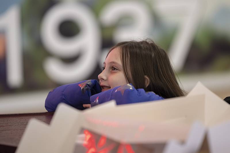 Scarlett Mayberry, 7, of Rock Falls picks up some fire safety coloring books Saturday, Jan. 11, 2025, at the mall. The Sterling and Rock Falls fire departments held a joint fire safety event at the mall. Smoke detectors and other safety equipment were handed out along with information on safety and prevention.