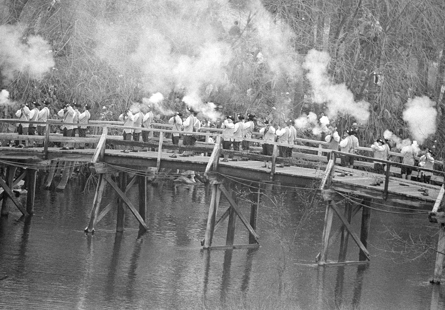 Modern-day Minutemen fire a salute on Old North Bridge in Concord, Massachusetts, on April 20, 1975, marking the 200th anniversary of the "shot heard round the world" and the start of the Revolutionary War.