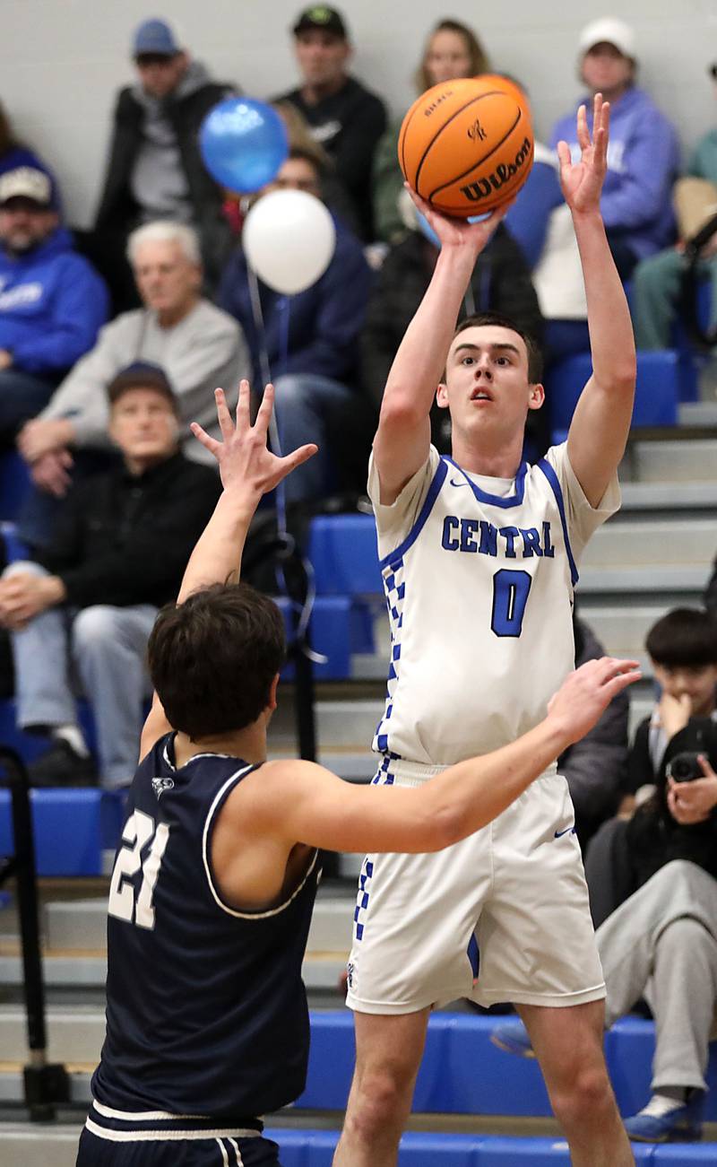 Burlington Central's Patrick Magan shoots the ball over Cary-Grove's Brady Elbert during a Fox Valley Conference boys basketball game on Friday, February. 6, 2026, at Burlington Central High School.