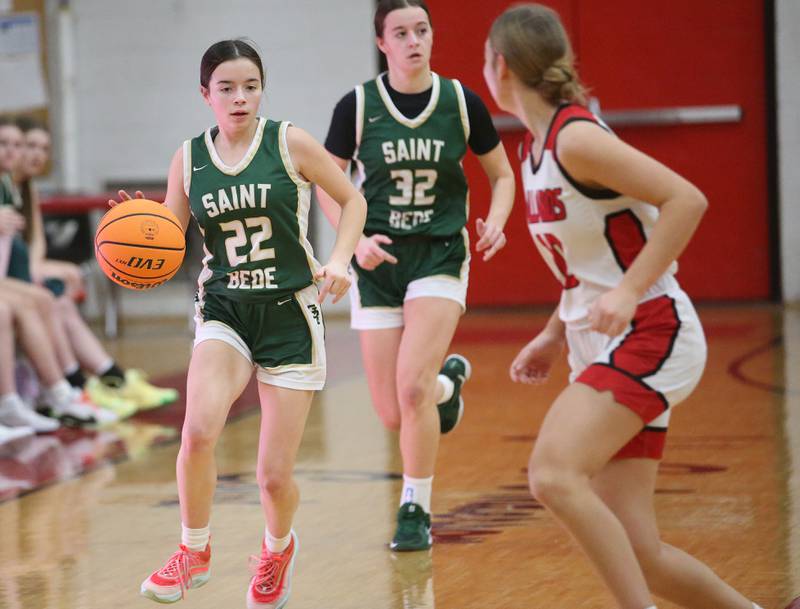 St. Bede's Bailey Engles dribbles the ball up the floor as Henry-Senachwine's Rachael Eckert defends on Thursday, Jan. 30, 2025 at Henry-Senachwine High School.