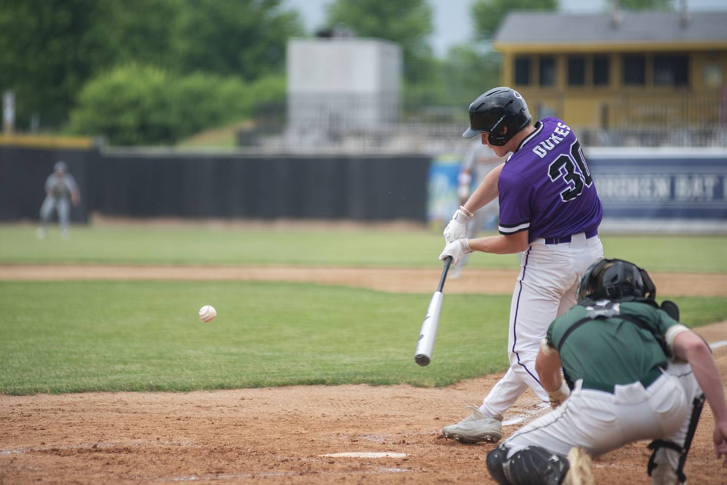 Dixon’s Max Clark swings at a pitch Monday June 13, 2022 during the NIC-10 vs Big Northern Conference underclassmen all-star game.