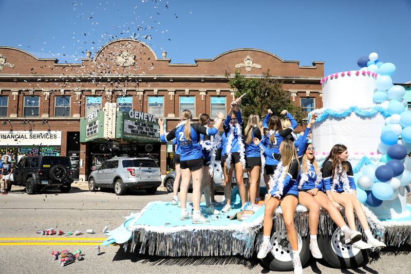 Geneva High School volleyball players ride a float during the school’s annual homecoming parade on State Street on Friday, Sept. 15, 2023.