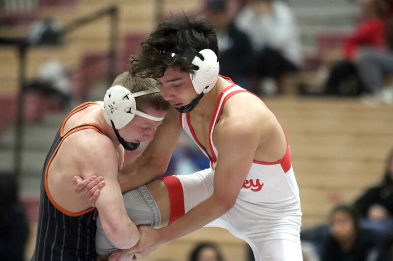 Huntley’s Cameron Abordo, right, battles Crystal Lake Central’s Peyton Ramsey at 120 pounds in varsity wrestling on Friday, Dec. 13, 2024 at Huntley High School in Huntley.