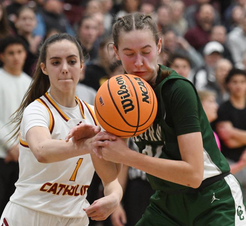 Montini's Nicolette Kerstein, left, taps the ball away from Grayslake Central's Peyton Hoffmann, but the Rams recovered the ball on the play during the Hersey Class 3A supersectional on Monday, March 3, 2025 in Arlington Heights.