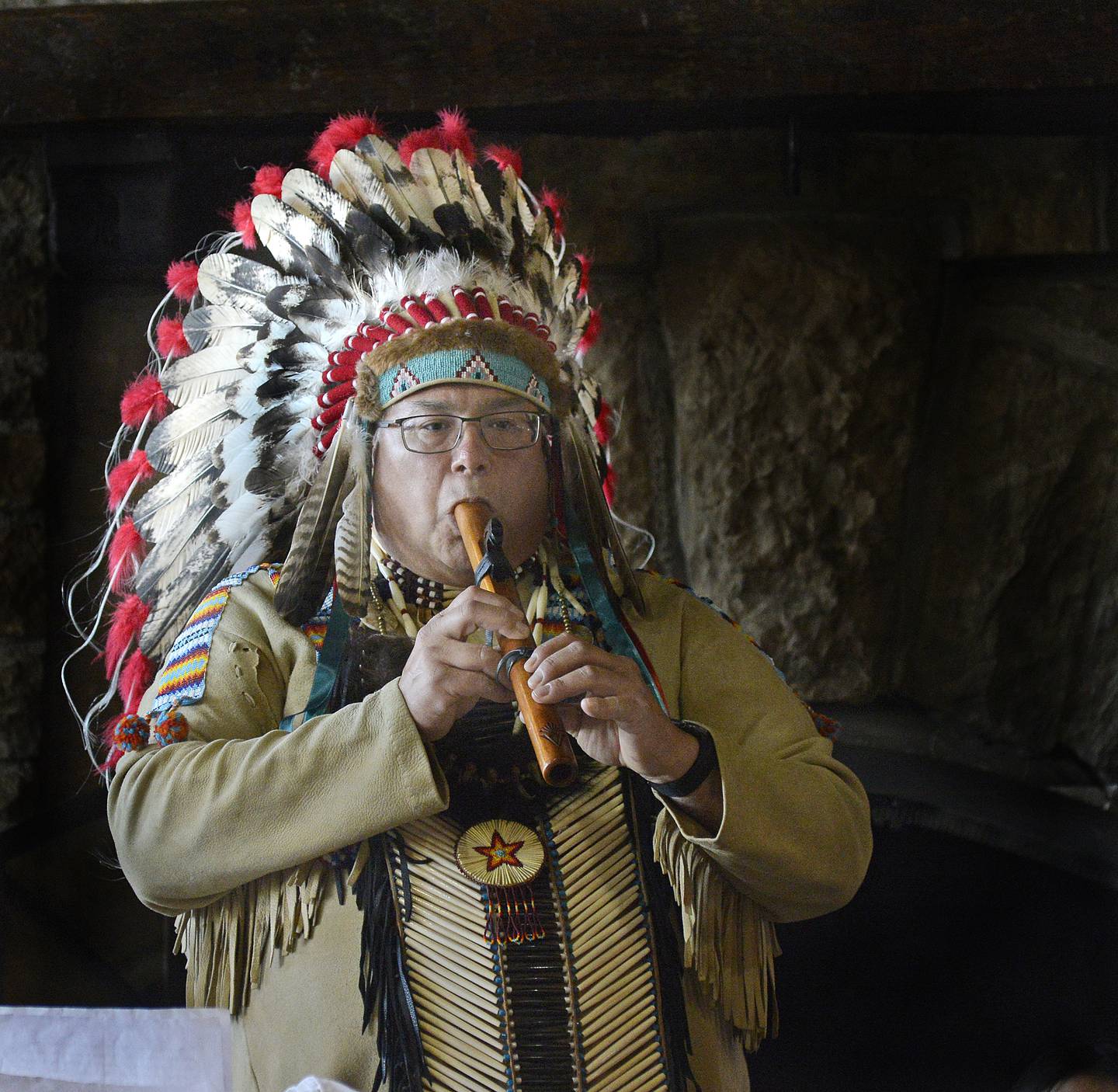 Gerald “Chief White Winnebago” Savage demonstrates a Native American flute Sunday, March 20, 2022, in The Great Hall at Starved Rock Lodge during an afternoon of Native American Ceremonies.