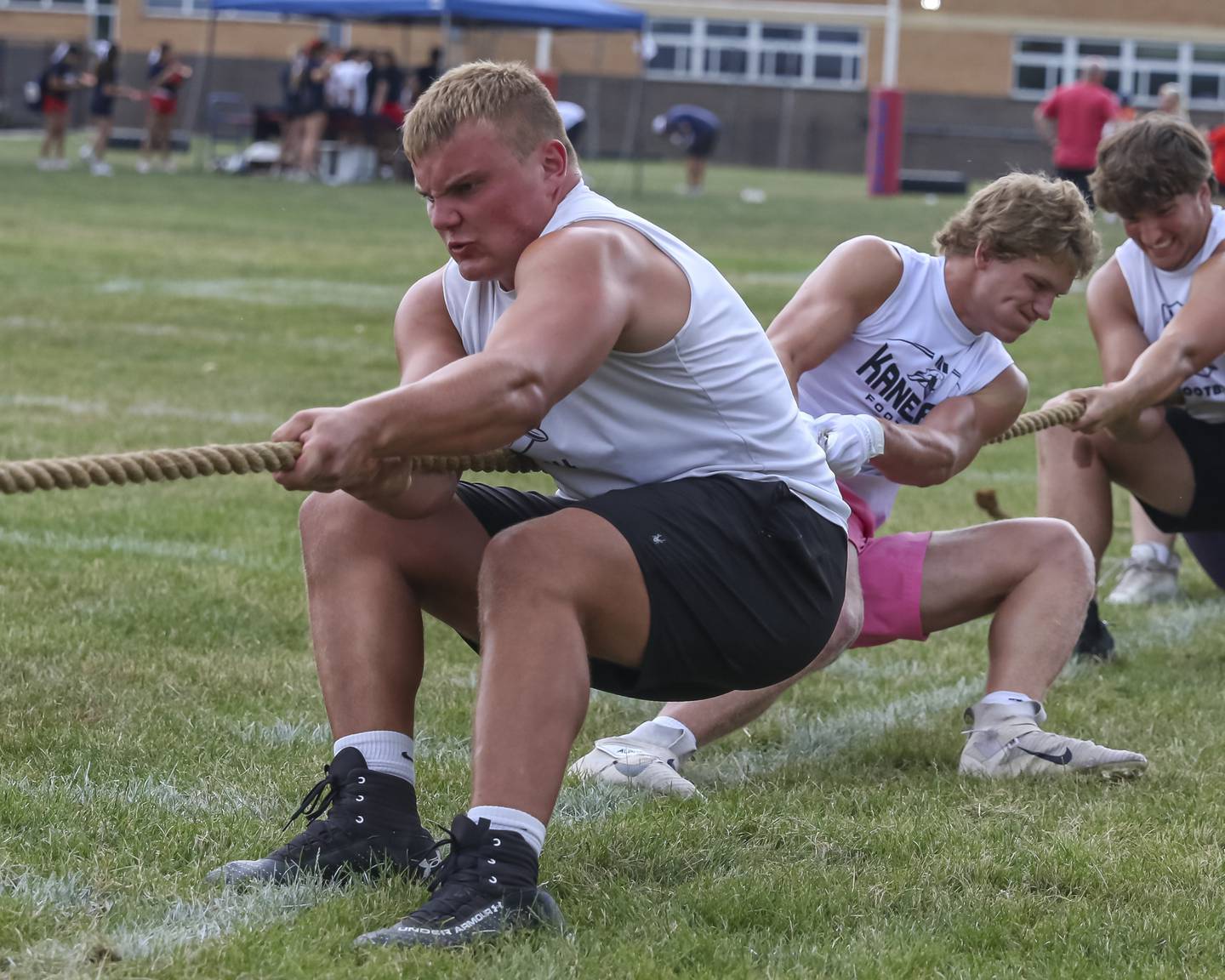 Kaneland's Jake Buckley leads his team in the Tug of War Tournament during the West Aurora "Battle of the Butts" Lineman Challenge, July 10, 2025  in Aurora.