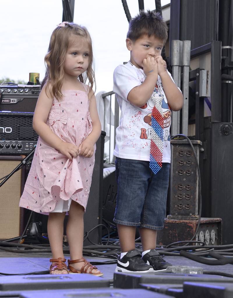 Winners of Lil Miss Sparkler and Mr Firecracker, Cameron Harris and Lincoln Tamez, pose for photos Wednesday, July 6, 2022, during Streator's 4th of July Celebration opening ceremonies at Northpoint Plaza.