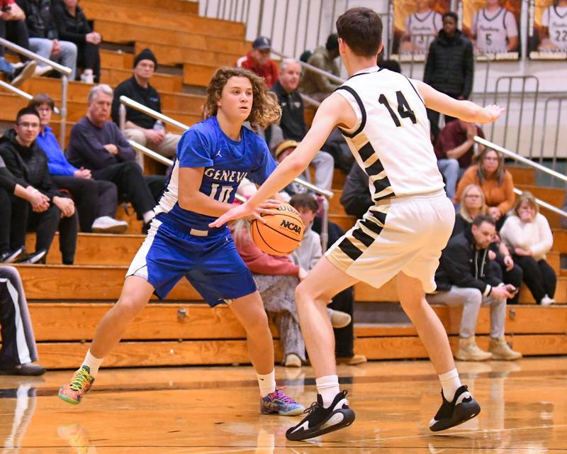 Geneva's Codey Rader (10) looks for an open teammate while being defended by Glenbard North's George Schager (14) during the game on Tuesday Jan. 6, 2026, held at Glenbard North High School.
