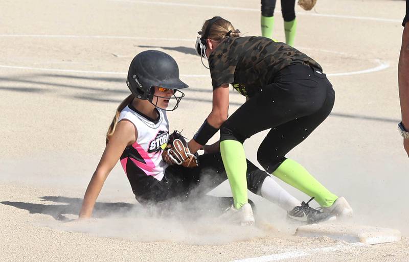 Kishwaukee Valley Storm's Isla Eidsness slides into third but is tagged out attempting to steal Friday, June 24, 2022, during their 12u game against the Midwest Aftershock in the 22nd annual Storm Dayz tournament at the Sycamore Community Sports Complex.