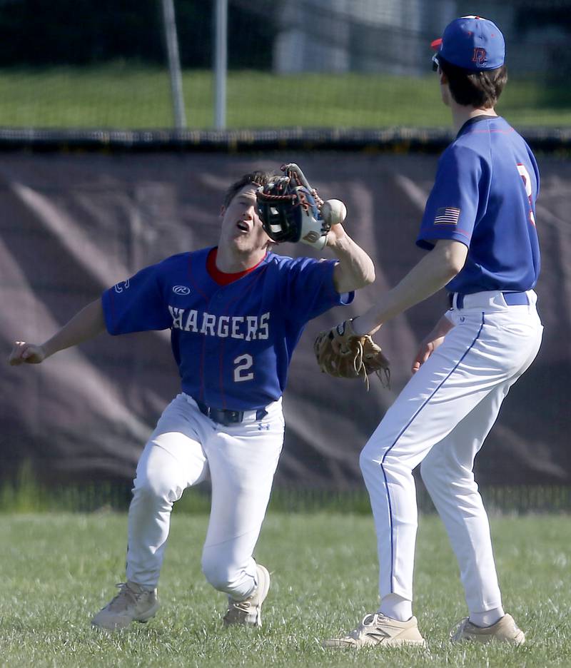 Dundee-Crown's Logan Gutierrez tries to catch a ball hit by Huntley's Alexander Behles in front of his teammate, Nathan Bushy , during a Fox Valley Conference baseball game on Friday, May 9, 2025, at Huntley High School. a error was scored on the play to Gutierrez.