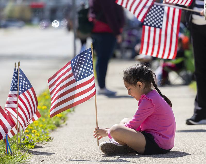 Chella Hey, 8, patiently waits for a parade Saturday, April, 26, 2025, at John Dixon Park in Dixon. Dixon VFW Post 540 held a Vietnam veteran parade down Galena Avenue to recognize those veterans who didn’t receive the thank you they deserved.