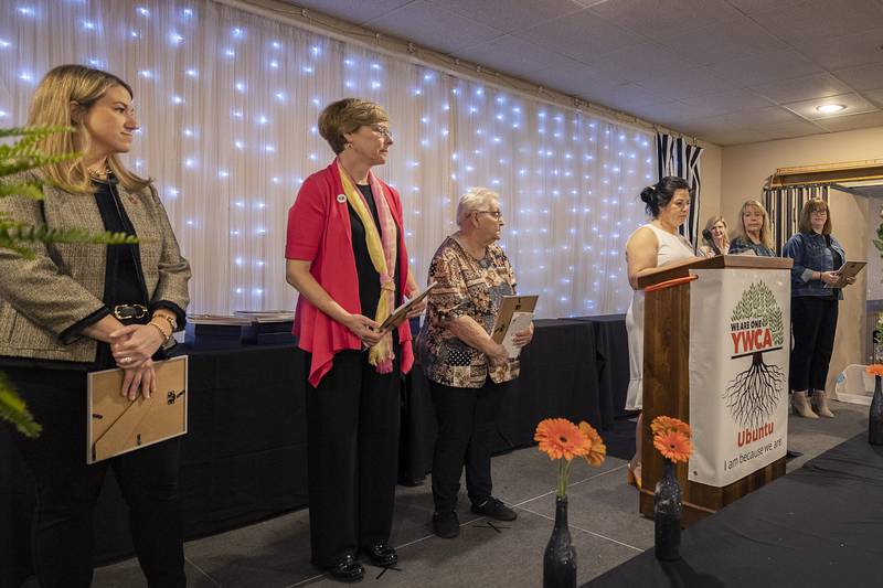 YWCA Executive Director Rebecca Munoz-Ripley (middle) starts the ceremony Thursday, April 18, 2024 for the 41st YWCA Women of Achievement Luncheon.