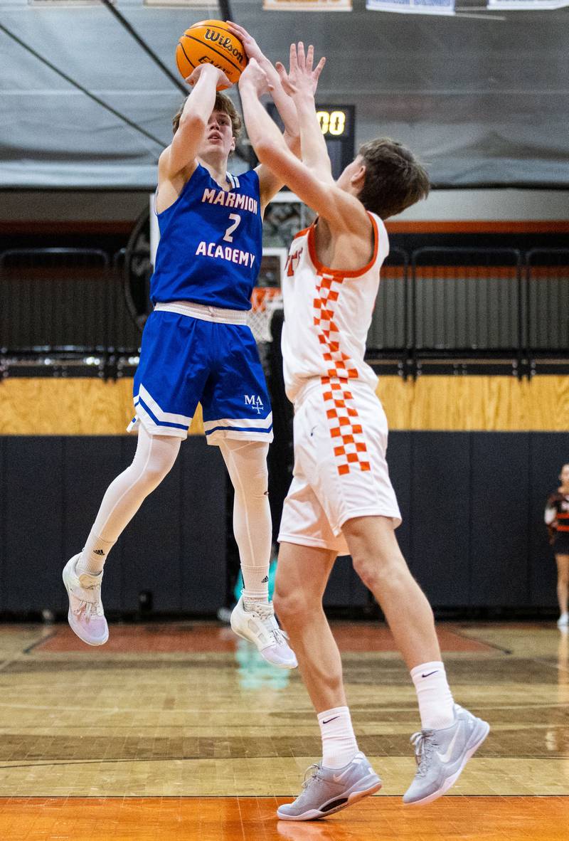 Marmion Academy guard Caden Anderson shoots a two-point field goal during a game against St. Charles East High School on Saturday, Jan. 4, 2025.