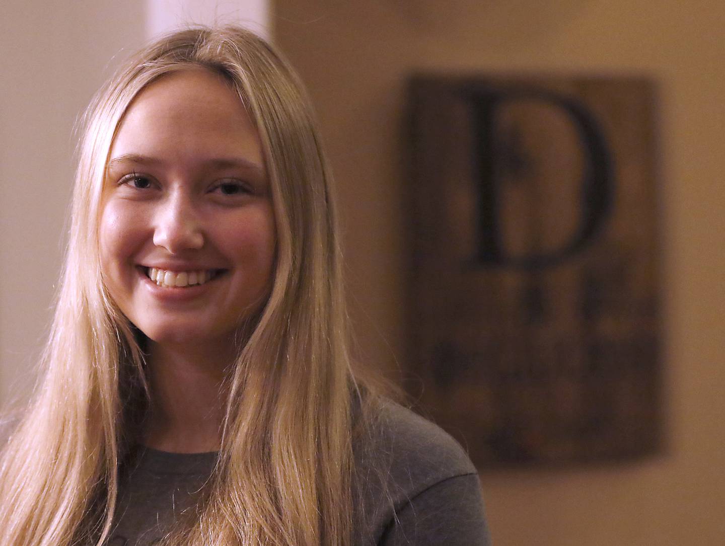 Gabi DeGiulio, who lost her father, Vince, in 2019, in her home in Palatine. She is a member of the One Million Monarchs, an organization that helps teenagers grieve the loss of a loved one. The Crystal Lake organization has received a grant that will help them expand the program, add more members and include more retreats.
