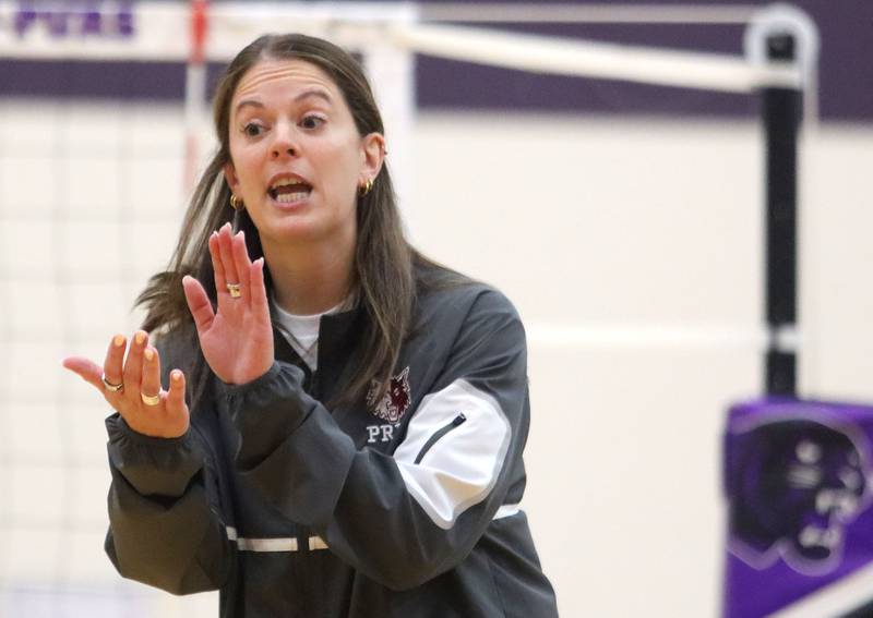 Prairie Ridge’s Head Coach Leah Groat leads the Wolves in varsity girls volleyball at Hampshire High School in Hampshire on Tuesday, Sept. 2, 2025.