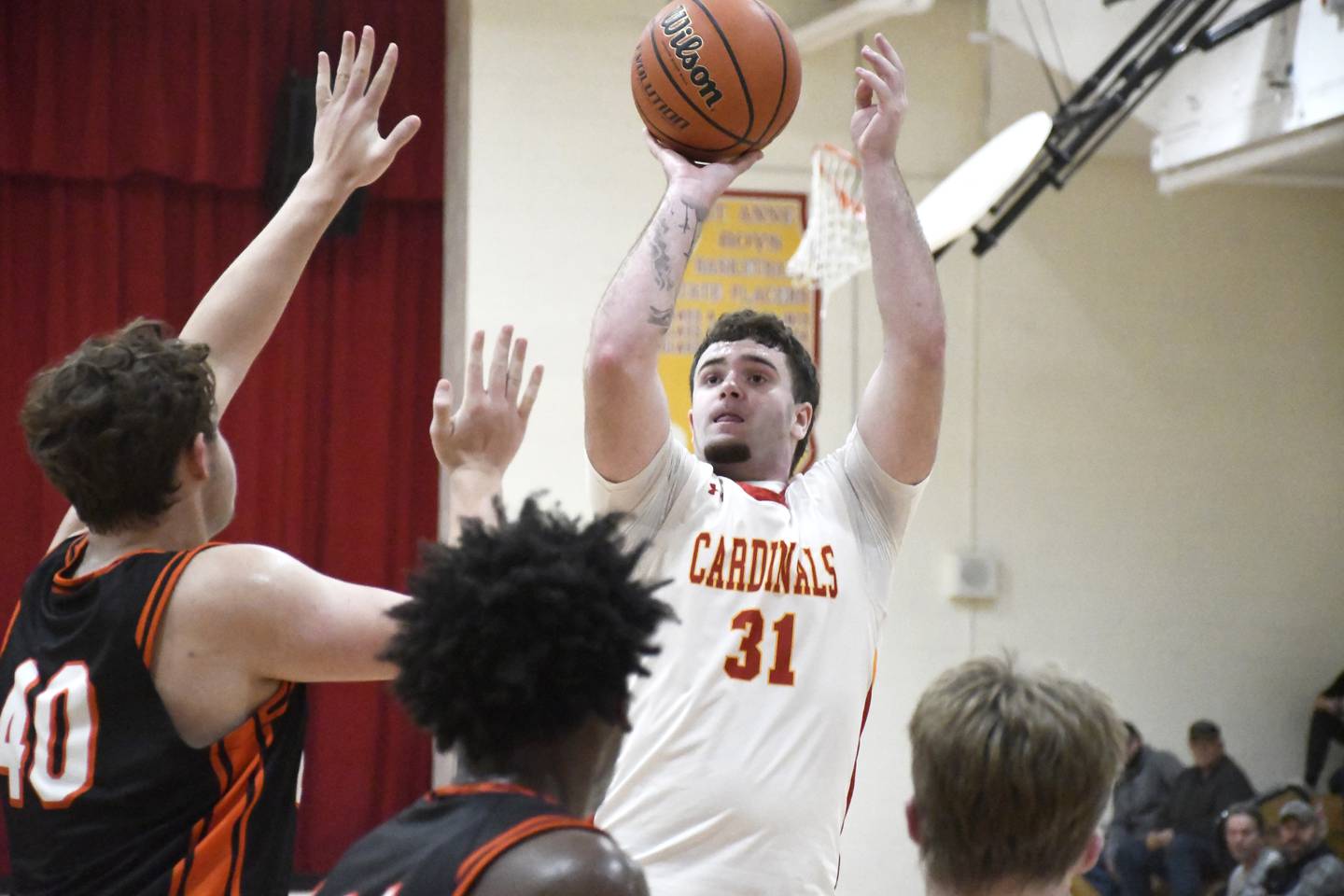 St. Anne's Brandon Schoth elevates for a jump shot while contested by Gardner-South Wilmington's Holden Grimes during St. Anne's 52-45 victory over Gardner-South Wilmington on Tuesday, January 13, 2026.