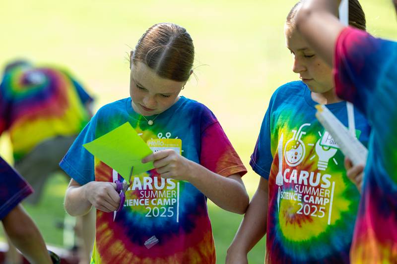 Ahvi cuts paper rocket at the 23rd annual Carus Summer Science Camp on Friday, July 18, 2025 at St. Bede High School in Peru.