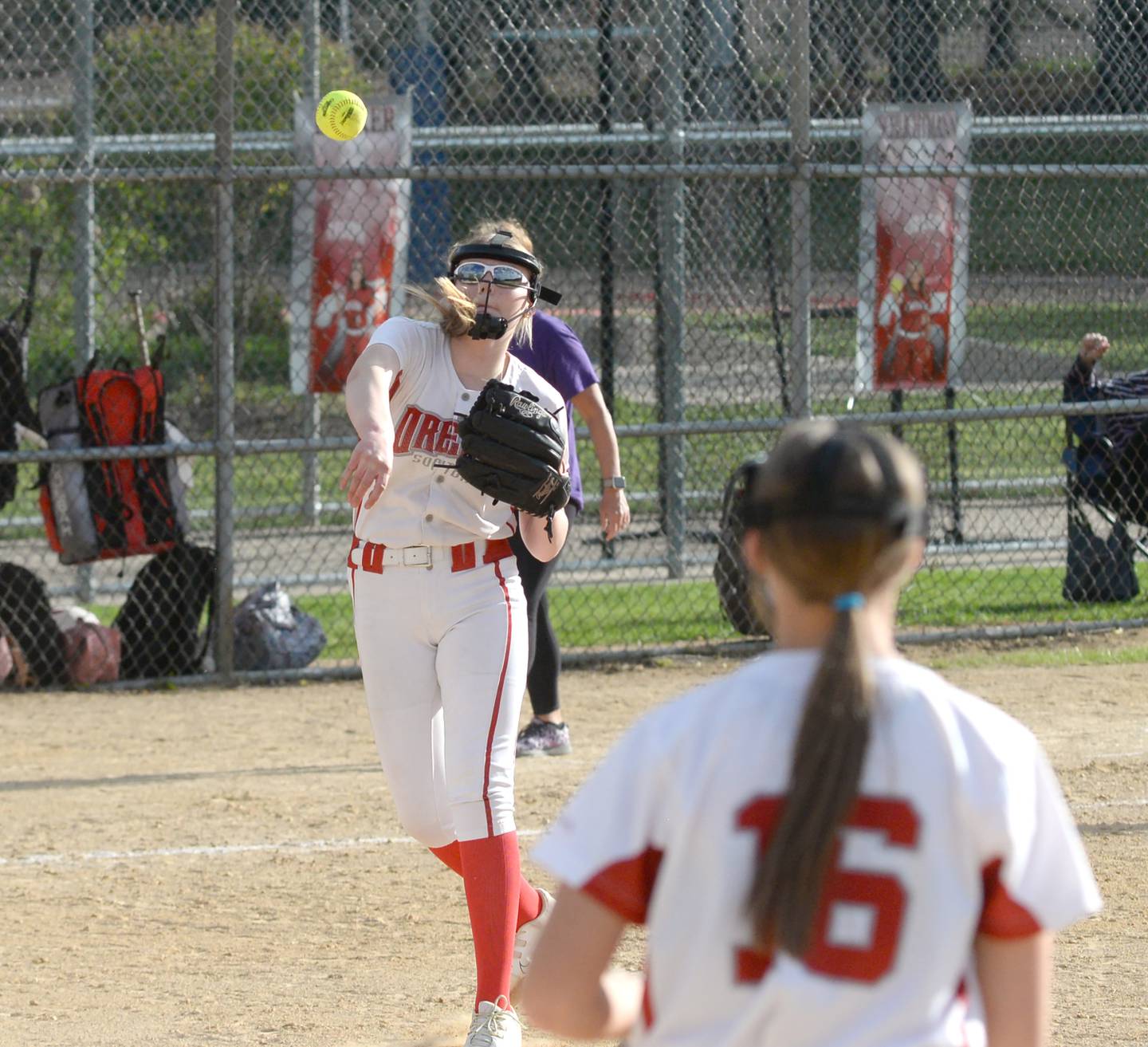 Oregon pitcher Isabelle Berg throws to first for an out during Tuesday, May 7, 2025 action against Dixon at Oregon Park West.