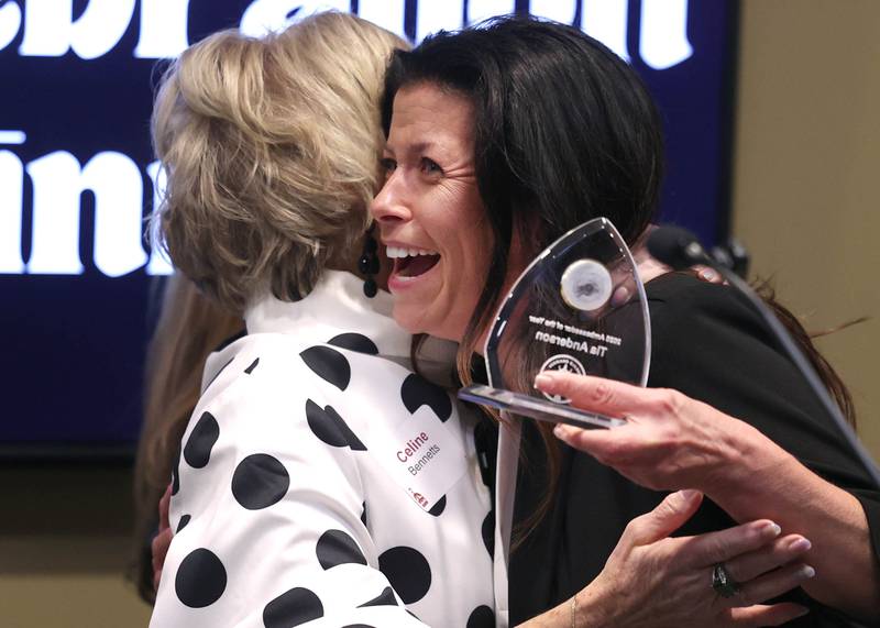 Tia Anderson (right) gets a hug from Celine Bennetts after accepting the Ambassador of the Year Award Thursday, Feb. 5, 2026, during the DeKalb Chamber of Commerce Annual Celebration Dinner at Faranda's Banquet & Conference Center.