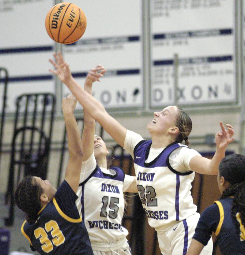 Dixon's Makenze Toms and  Morgan Hargrave battle for a ball with Sterling's Joslynn James . Dixon and Sterling girls basketball teams played in the 3rd place game of the Dixon Girls KSB Holiday Basketball Classic Saturday, Dec. 28, 2024.
