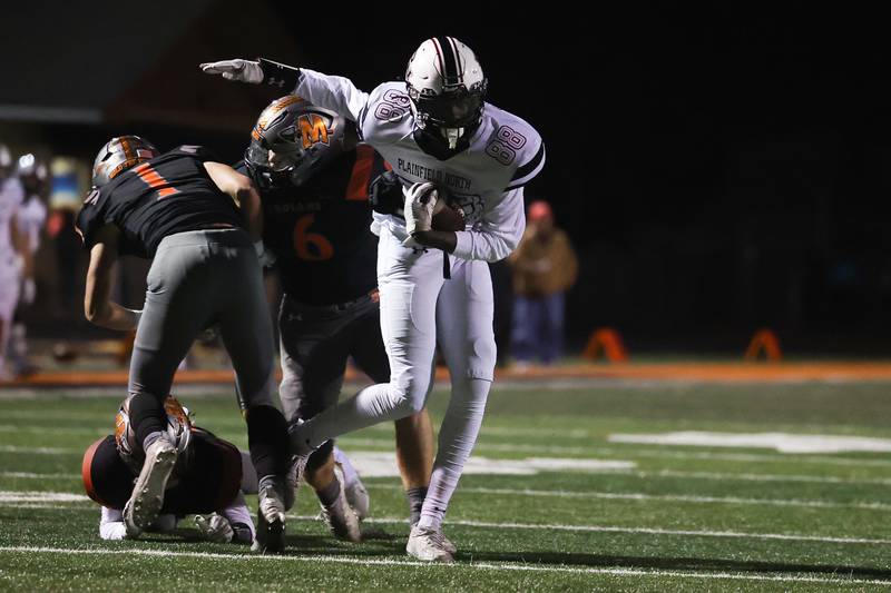 Plainfield North’s Shibu Mohammed spins around of host of Minooka defenders. Friday, Oct. 7, 2022, in Minooka.