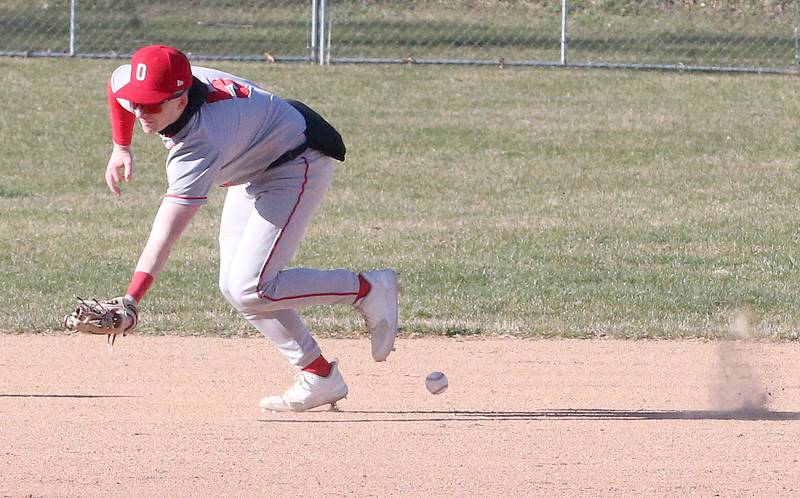 Ottawa's Jacob Rosetto draws an error while attempting to field a ground ball at short against St. Bede on Wednesday, March 20, 2024 at St. Bede Academy.