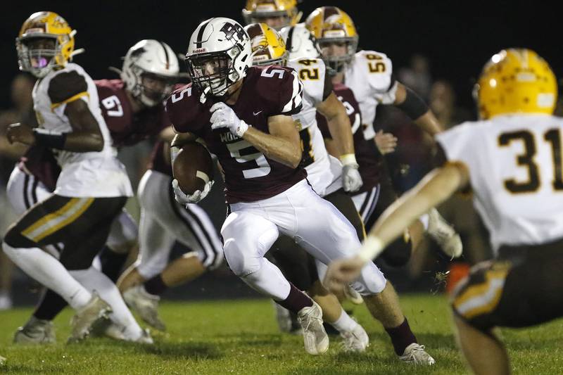 Prairie Ridge's Zachary Bentsen runs the ball through the Jacobs defense hosted Jacobs for their week 4 football game on Friday, Sept. 17, 2021 at Prairie Ridge High School in Crystal Lake.